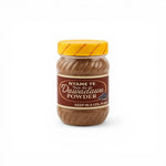 Duaba Afro Dawadawa Powder, a fermented African locust bean seasoning in a clear jar with a yellow lid. 200g.